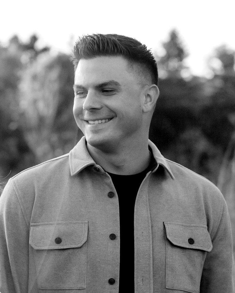Tyler Green, Assistant Pastor of Legacy House, smiling outdoors